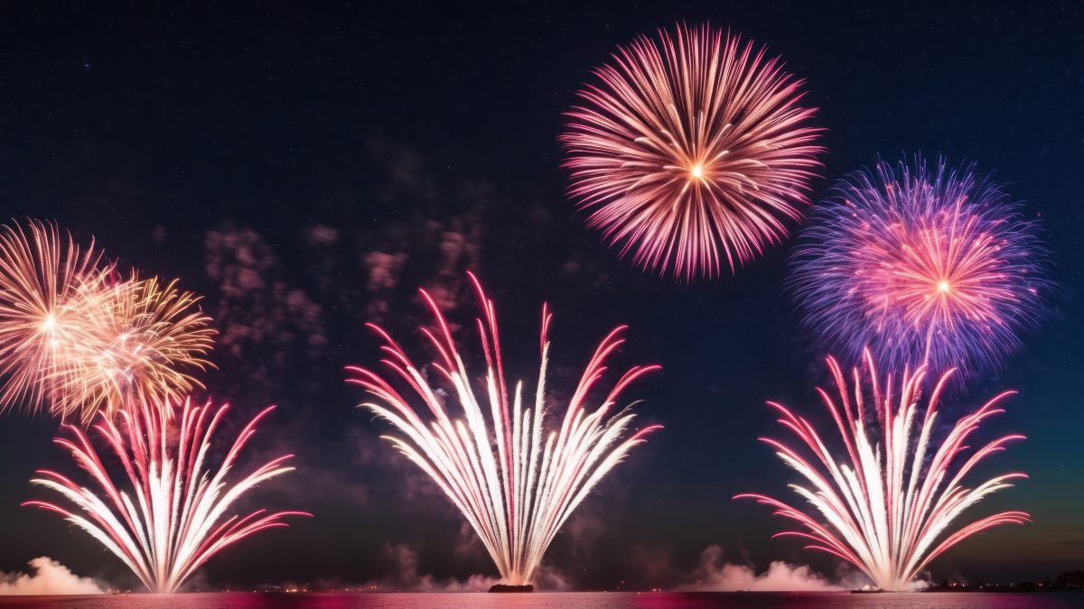 A vibrant fireworks display lighting up a starry night sky in celebration